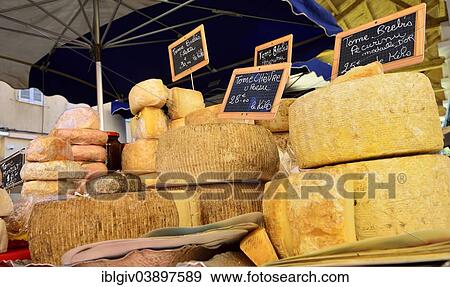 Stock Photo - "Various types of cheeses at a market stall, L'Ile-Rousse, Balagne, Corsica, France, Europe". Fotosearch