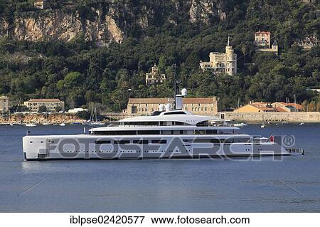 Stock Photo - Vava II, a cruiser built by Pendennis Plus, formerly Devenport Yachts, length: 96 m, built in 2012, owned by Ernesto Bertarelli, anchored in the bay of Villefranche, French Riviera, France, Mediterranean Sea, Europe. Fotosearch