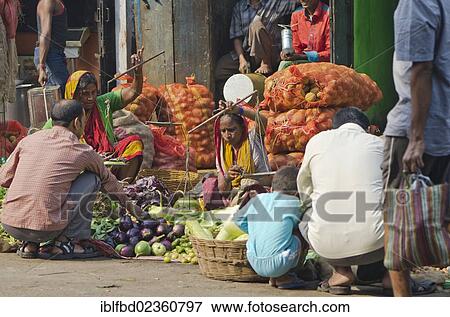 Stock Photo - "Vegetable seller in the streets of Kolkata, India, Asia". Fotosearch