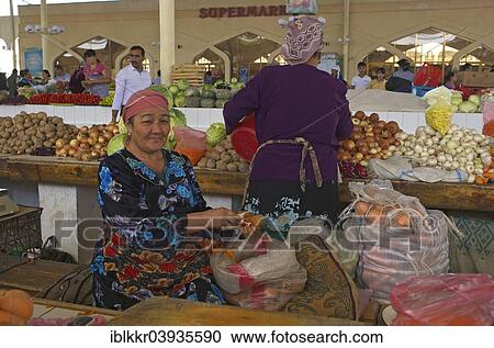 Stock Image - "Vegetable sellers at a bazaar, Bukhara, Uzbekistan, Asia". Fotosearch