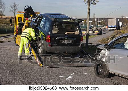 "Vehicle involved in an accident on a tow truck, Germany, Europe" View Large Photo Image Stock Photo - "Vehicle involved in an accident on a tow truck, Germany, Europe". Fotosearch