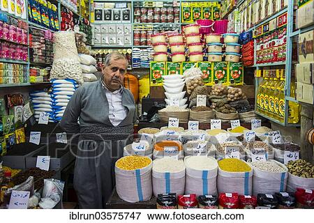 Stock Photo - "Vendor in his stall in the bazaar of Sulaymaniyah, Sulaymaniyah, Iraqi Kurdistan, Iraq, Asia". Fotosearch