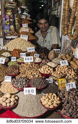 Picture - "Vendor selling nuts and spices, spice market, Old Delhi, New Delhi, Delhi, India, Asia". Fotosearch