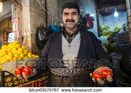 "Vendor selling tomatoes in the bazaar of Sulaymaniyah, Sulaymaniyah, Iraqi Kurdistan, Iraq, Asia" View Large Photo Image Stock Photo - "Vendor selling tomatoes in the bazaar of Sulaymaniyah, Sulaymaniyah, Iraqi Kurdistan, Iraq, Asia". Fotosearch
