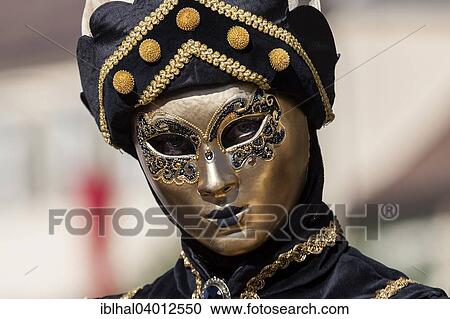 Stock Image - "Venetian Carnival mask and costume at the Venetian Fair on the historic market square, Ludwigsburg, Baden-Wurttemberg, Germany, Europe". Fotosearch