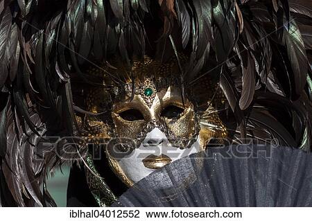 Stock Image - "Venetian Carnival mask and costume at the Venetian Fair on the historic market square, Ludwigsburg, Baden-Wurttemberg, Germany, Europe". Fotosearch