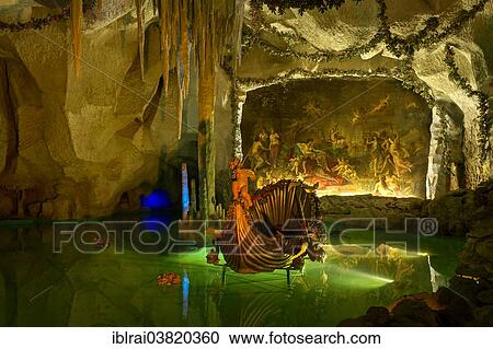 "Venus Grotto of King Ludwig II, artificial stalactite cave with a lake and a shell-shaped boat, painting """"Tannhauser bei Frau Venus"""" by August von Heckel, palace gardens of Linderhof Palace, Upper Bavaria, Bavaria, Germany, Europe" View Large Photo Image Stock Image - "Venus Grotto of King Ludwig II, artificial stalactite cave with a lake and a shell-shaped boat, painting """"Tannhauser bei Frau Venus"""" by August von Heckel, palace gardens of Linderhof Palace, Upper Bavaria, Bavaria, Germany, Europe". Fotosearch