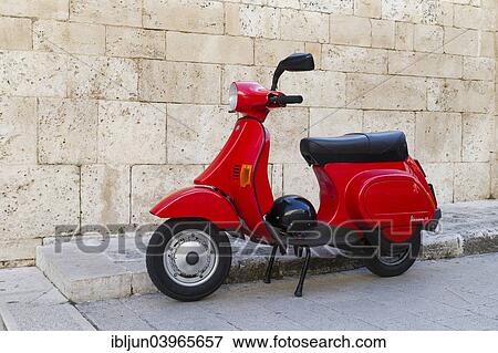 "Vespa 50, red scooter with helmet parked in front of a wall, Alberobello, Apulia, Italy, Europe" View Large Photo Image Stock Photo - "Vespa 50, red scooter with helmet parked in front of a wall, Alberobello, Apulia, Italy, Europe". Fotosearch
