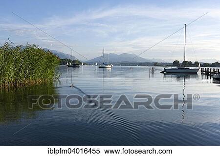 "View across lake Chiemsee to the Bavarian Alps, Chiemgau, Upper Bavaria, Bavaria, Germany, Europe" View Large Photo Image Stock Photography - "View across lake Chiemsee to the Bavarian Alps, Chiemgau, Upper Bavaria, Bavaria, Germany, Europe". Fotosearch