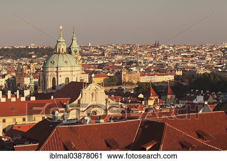 Stock Image - "View across Mala Strana, Lesser Town of Prague, with St. Nicholas Church and the Mala Strana Bridge Tower, Prague, Bohemia, Czech Republic, Europe". Fotosearch