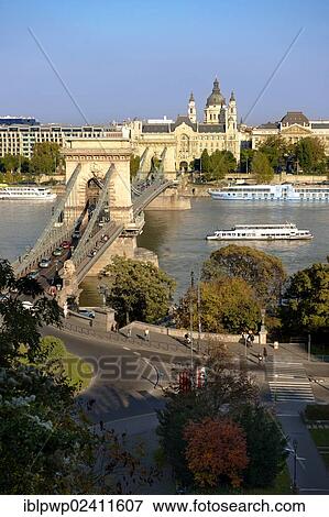 View across the Danube to Pest from The Buda Castle Hill, with the Szecheni Chain Bridge, Lanchid, Budapest, Hungary, Europe View Large Photo Image Stock Photo - View across the Danube to Pest from The Buda Castle Hill, with the Szecheni Chain Bridge, Lanchid, Budapest, Hungary, Europe. Fotosearch