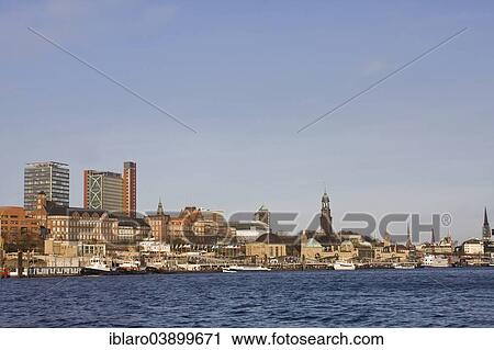 Stock Image - "View across the Elbe River to the St Pauli Landing Stages, Port of Hamburg, Hamburg, Germany, Europe". Fotosearch