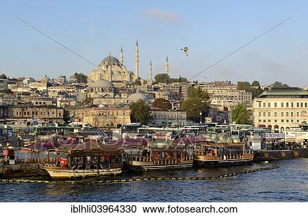 Stock Image - "View across the Golden Horn, Suleymaniye Mosque at the back, Eminonu District, European side, Istanbul, Turkey, Asia". Fotosearch