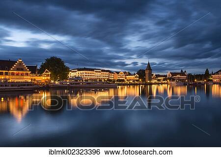 "View across the harbor of Lindau towards the illuminated promenade of the historic district of Lindau, Lake Constance, Bavaria, Germany, Europe" View Large Photo Image Stock Photograph - "View across the harbor of Lindau towards the illuminated promenade of the historic district of Lindau, Lake Constance, Bavaria, Germany, Europe". Fotosearch