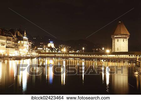 View across the Reuss river, Kapellbrucke bridge and the water tower, historic district of Lucerne, Switzerland, Europe View Large Photo Image Picture - View across the Reuss river, Kapellbrucke bridge and the water tower, historic district of Lucerne, Switzerland, Europe. Fotosearch