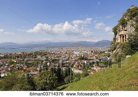 "View across the town of Fethiye with Lycian rock tombs, right, Lycian coast, Fethiye, Mugla Province, Aegean region, Turkey, Asia" View Large Photo Image Stock Photograph - "View across the town of Fethiye with Lycian rock tombs, right, Lycian coast, Fethiye, Mugla Province, Aegean region, Turkey, Asia". Fotosearch