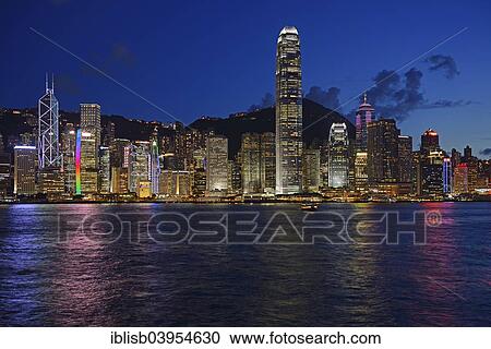Stock Image - "View at the blue hour from Kowloon on Hong Kong Island's skyline on Hong Kong River, Central, with Bank of China on the far left and IFC Tower far right, Hong Kong, China, Asia". Fotosearch