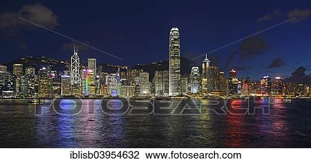 Stock Image - "View at the blue hour from Kowloon on Hong Kong Island's skyline on Hong Kong River, Central, with Bank of China on the far left and IFC Tower far right, Hong Kong, China, Asia". Fotosearch