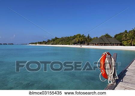Stock Photography - "View from a jetty with a life buoy of the beach with a gazebo, Indian Ocean, Lankanfinolhu, North Male Atoll, Maldives, Asia". Fotosearch