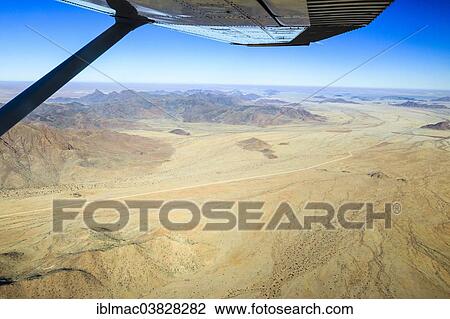 "View from a small plane over the foothills of the Namib Desert, ‪Namib-Naukluft National Park‬, Namibia, Africa" View Large Photo Image Stock Image - "View from a small plane over the foothills of the Namib Desert, ‪Namib-Naukluft National Park‬, Namibia, Africa". Fotosearch
