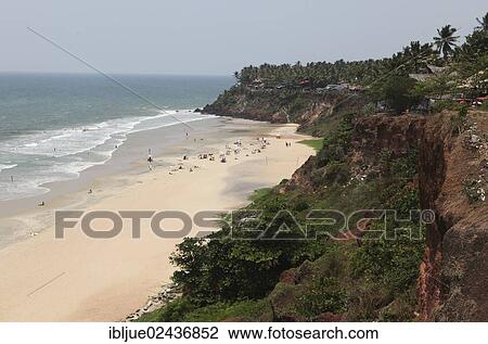 Stock Image - "View from above onto Varkala Beach, rocky coast, Kerala, India, Asia". Fotosearch