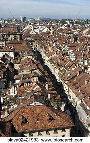 View from above over the red-tiled roofs of the houses in the historic town center of Bern, Switzerland, Europe View Large Photo Image Stock Image - View from above over the red-tiled roofs of the houses in the historic town center of Bern, Switzerland, Europe. Fotosearch