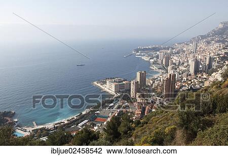 "View from above over the tennis courts of the Monte Carlo Country Club, Monte Carlo Bay Hotel & Resort and the skyscrapers of Monte Carlo, Principality of Monaco, Cote d'Azur, Mediterranean Sea, Europe" View Large Photo Image Stock Image - "View from above over the tennis courts of the Monte Carlo Country Club, Monte Carlo Bay Hotel & Resort and the skyscrapers of Monte Carlo, Principality of Monaco, Cote d'Azur, Mediterranean Sea, Europe". Fotosearch