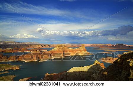 Stock Image - "View from Alstrom Point to Lake Powell at sunset, Padre Bay with Gunsight Butte and Navajo Mountain, houseboats, Bigwater, Glen Canyon National Recreation Area, Arizona, Southwestern USA, Utah, USA". Fotosearch