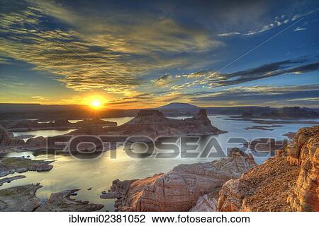 Stock Image - "View from Alstrom Point to Lake Powell at sunrise, Padre Bay with Gunsight Butte and Navajo Mountain, houseboats, Bigwater, Glen Canyon National Recreation Area, Arizona, Southwestern USA, Utah, USA". Fotosearch