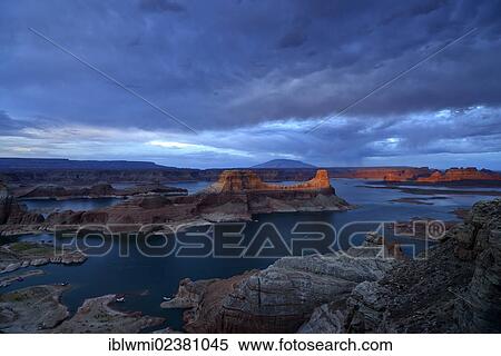 Stock Photography - "View from Alstrom Point to Lake Powell at sunset, dusk, Padre Bay with Gunsight Butte and Navajo Mountain, houseboats, Bigwater, Glen Canyon National Recreation Area, Arizona, Southwestern USA, Utah, USA". Fotosearch