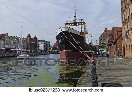 Stock Photo - "View from Bleihof island of the Motlawa river, ship """"Soldek"""" at front, first boat built in the Gdansk shipyard after the Second World War, Gdansk, Poland, Europe". Fotosearch