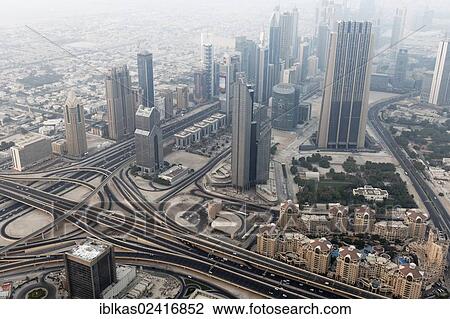 View from Burj Khalifa over a motorway junction and Dubai International Financial Centre, United Arab Emirates, Middle East, Asia View Large Photo Image Stock Image - View from Burj Khalifa over a motorway junction and Dubai International Financial Centre, United Arab Emirates, Middle East, Asia. Fotosearch