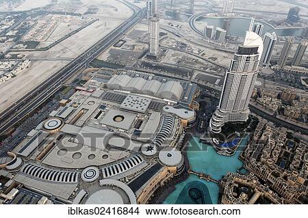 View from Burj Khalifa over Dubai Mall, Fountain Lake and a luxury hotel, The Address, Dubai, United Arab Emirates, Middle East, Asia View Large Photo Image Picture - View from Burj Khalifa over Dubai Mall, Fountain Lake and a luxury hotel, The Address, Dubai, United Arab Emirates, Middle East, Asia. Fotosearch