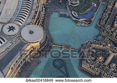 View from Burj Khalifa towards Dubai Mall and Fountain Lake, Dubai, United Arab Emirates, Middle East, Asia View Large Photo Image Stock Photo - View from Burj Khalifa towards Dubai Mall and Fountain Lake, Dubai, United Arab Emirates, Middle East, Asia. Fotosearch