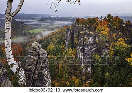 "View from Ferdinandstein over the autumnal Bastei, Saxon Switzerland National Park, Saxony, Germany, Europe" View Large Photo Image Stock Image - "View from Ferdinandstein over the autumnal Bastei, Saxon Switzerland National Park, Saxony, Germany, Europe". Fotosearch