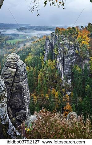 "View from Ferdinandstein over the autumnal Bastei, Saxon Switzerland National Park, Saxony, Germany, Europe" View Large Photo Image Stock Photo - "View from Ferdinandstein over the autumnal Bastei, Saxon Switzerland National Park, Saxony, Germany, Europe". Fotosearch