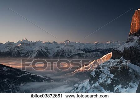 "View from Gemmi Pass to Leukerbad and the Pennine Alps with Mt Matterhorn at sunset, Canton of Valais, Switzerland, Europe" View Large Photo Image Stock Image - "View from Gemmi Pass to Leukerbad and the Pennine Alps with Mt Matterhorn at sunset, Canton of Valais, Switzerland, Europe". Fotosearch