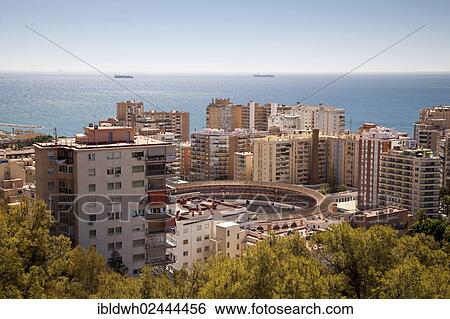 "View from Monte de Gibralfaro towards the ocean, skyscrapers surrounding a bullring, Malaga, Andalucia, Spain, Europe, PublicGround, Europe" View Large Photo Image Stock Photograph - "View from Monte de Gibralfaro towards the ocean, skyscrapers surrounding a bullring, Malaga, Andalucia, Spain, Europe, PublicGround, Europe". Fotosearch