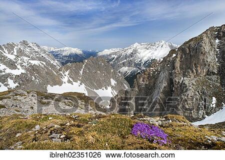 Stock Photograph - "View from Mt Hafelekar west, left at back Wetterstein range, mountains Pleisen-Spitze and Hohe Gleirsch, and the Karwendel mountain range, Austria, Europe". Fotosearch