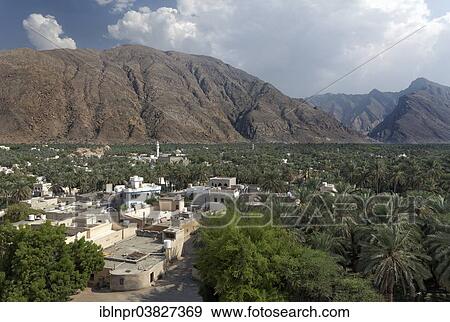 "View from Nakhl Fort or Husn Al Heem, fortress, across the Nakhl Oasis with date palms on the Jebel Nakhl Massif, Al-Batinah province, Sultanate of Oman, Arabian Peninsula" View Large Photo Image Stock Photo - "View from Nakhl Fort or Husn Al Heem, fortress, across the Nakhl Oasis with date palms on the Jebel Nakhl Massif, Al-Batinah province, Sultanate of Oman, Arabian Peninsula". Fotosearch