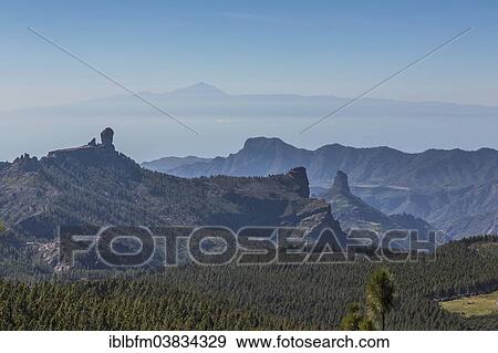 "View from Pico de las Nieves towards Roque Nublo Mountain, Teide Mountain on the island of Tenerife at the rear, Gran Canaria, Canary Islands, Spain, Europe" View Large Photo Image Stock Photo - "View from Pico de las Nieves towards Roque Nublo Mountain, Teide Mountain on the island of Tenerife at the rear, Gran Canaria, Canary Islands, Spain, Europe". Fotosearch