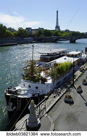 "View from Pont Alexandre III bridge across the Seine with houseboats and the Tour Eiffel, Eiffel Tower, 8th Arrondissement, Paris, France, Europe" View Large Photo Image Picture - "View from Pont Alexandre III bridge across the Seine with houseboats and the Tour Eiffel, Eiffel Tower, 8th Arrondissement, Paris, France, Europe". Fotosearch