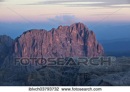 "View from Pordoi Pass of mountains Sellastock and Langkofel or Sasso Lungo at dusk, Dolomites, South Tyrol, Alto Adige, Italy, Europe" View Large Photo Image Stock Image - "View from Pordoi Pass of mountains Sellastock and Langkofel or Sasso Lungo at dusk, Dolomites, South Tyrol, Alto Adige, Italy, Europe". Fotosearch