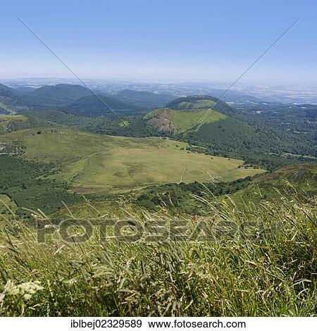 Stock Photo - "View from Puy de Dome onto the volcanic landscape of the Chaine des Puys, Auvergne, France, Europe". Fotosearch