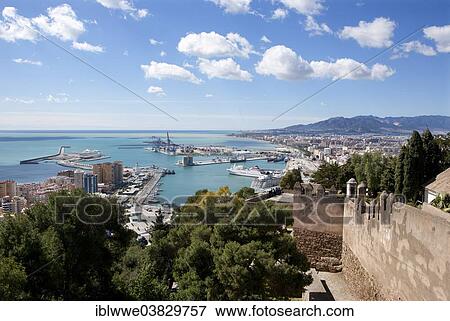 Stock Photo - "View from the Alcazaba, Moorish fortress, harbour, Castillo de Gibralfaro castle on Mount Gibralfaro, Malaga, Andalusia, Spain, Europe". Fotosearch