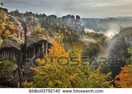 "View from the Bastei in fall at dawn, morning light, National Park Saxon Switzerland, Saxony, Germany, Europe" View Large Photo Image Stock Image - "View from the Bastei in fall at dawn, morning light, National Park Saxon Switzerland, Saxony, Germany, Europe". Fotosearch