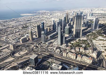 "View from the Burj Khalifa on skyscrapers on Sheikh Zayed Road, Dubai, United Arab Emirates, Asia" View Large Photo Image Stock Photograph - "View from the Burj Khalifa on skyscrapers on Sheikh Zayed Road, Dubai, United Arab Emirates, Asia". Fotosearch