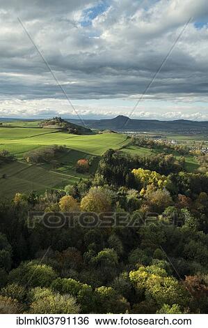"View from the fortress ruins of Hohenkrahen Castle over the Hegau landscape with Magdeberg Mountain and Hohenhewen Mountain, Baden-Wuerttemberg, Germany, Europe" View Large Photo Image Stock Photograph - "View from the fortress ruins of Hohenkrahen Castle over the Hegau landscape with Magdeberg Mountain and Hohenhewen Mountain, Baden-Wuerttemberg, Germany, Europe". Fotosearch