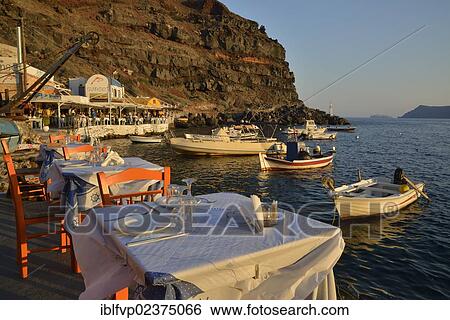 "View from the Katina restaurant to the fishing boats in the harbour of Ammoudi, Ammoudi Bay near Oia, Santorini, Cyclades, Greek island, Greece, Europe" View Large Photo Image Stock Photograph - "View from the Katina restaurant to the fishing boats in the harbour of Ammoudi, Ammoudi Bay near Oia, Santorini, Cyclades, Greek island, Greece, Europe". Fotosearch
