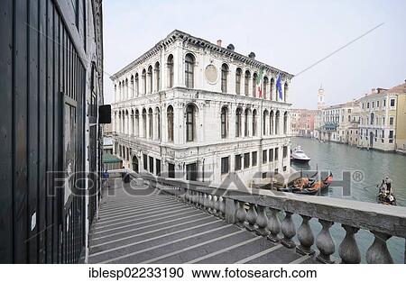 Stock Image - "View from the Rialto Bridge to gondolas and the Palazzo dei Camerlenghi, Grand Canal, Canal Grande, Venice, Venezia, Veneto, Italy, Europe". Fotosearch